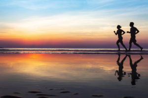 Couple running on the beach